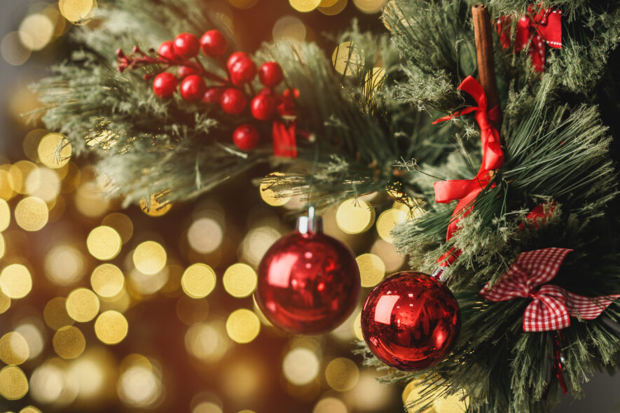 Christmas pine tree branch with decorations close up